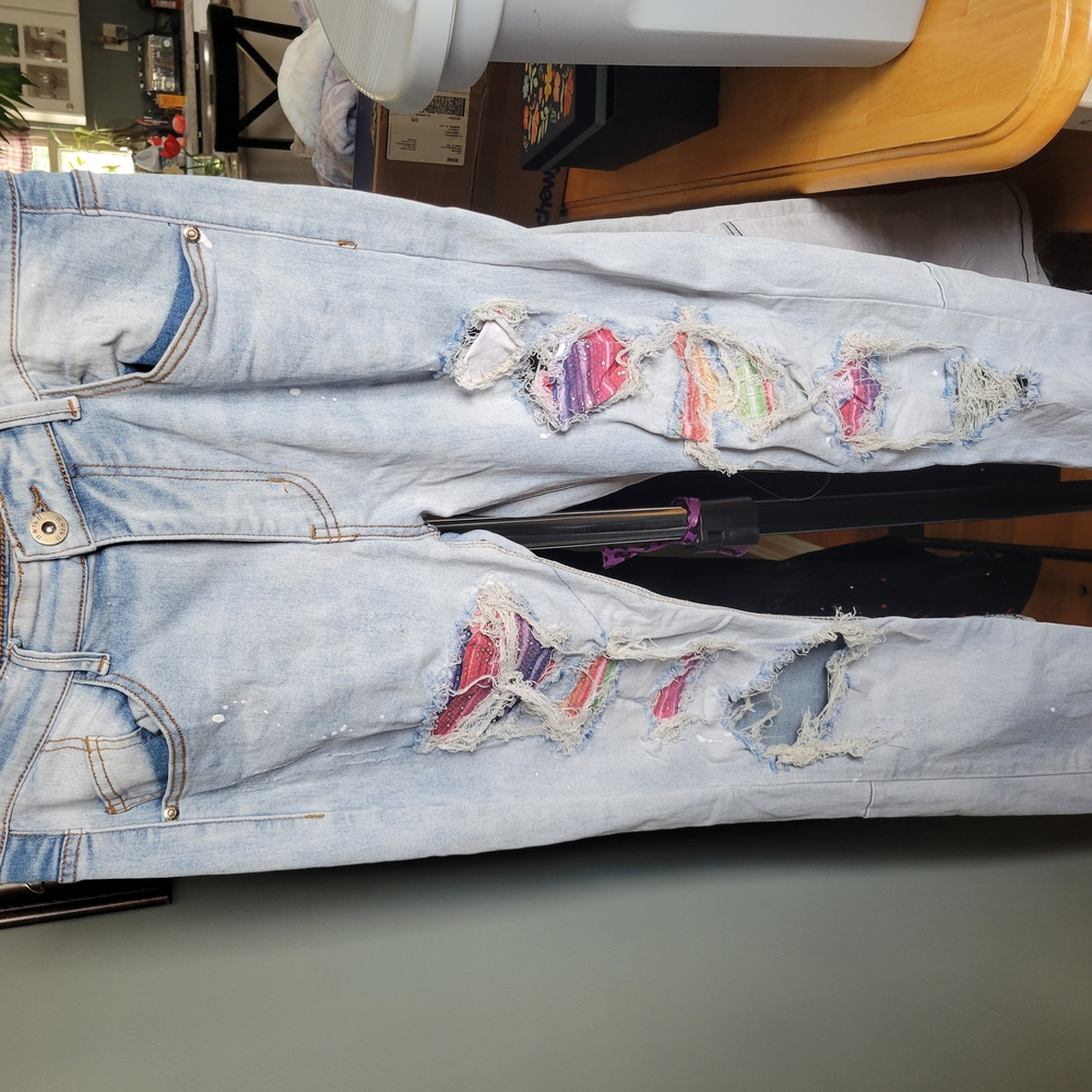 Trendy Light Blue Distressed Jeans with Multicolor Accents